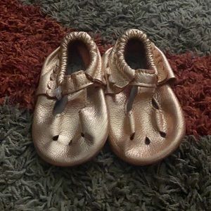 slightly worn rose gold Freshly Picked moccasins